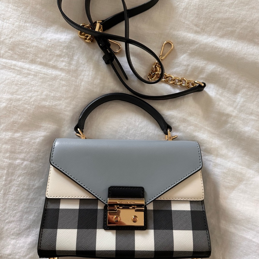 Stylish Michael Kors Blue and white Mini Bag with Gold Accents